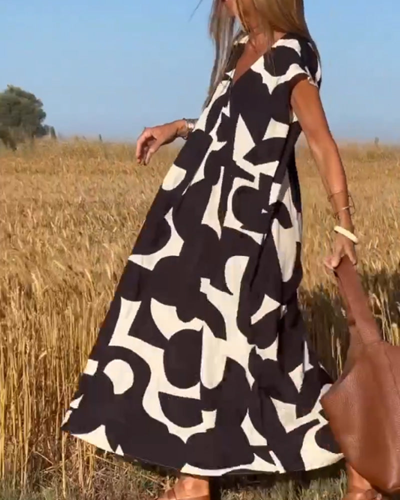 Vestido estampado con escote en V y corte fluido – STEPHARA